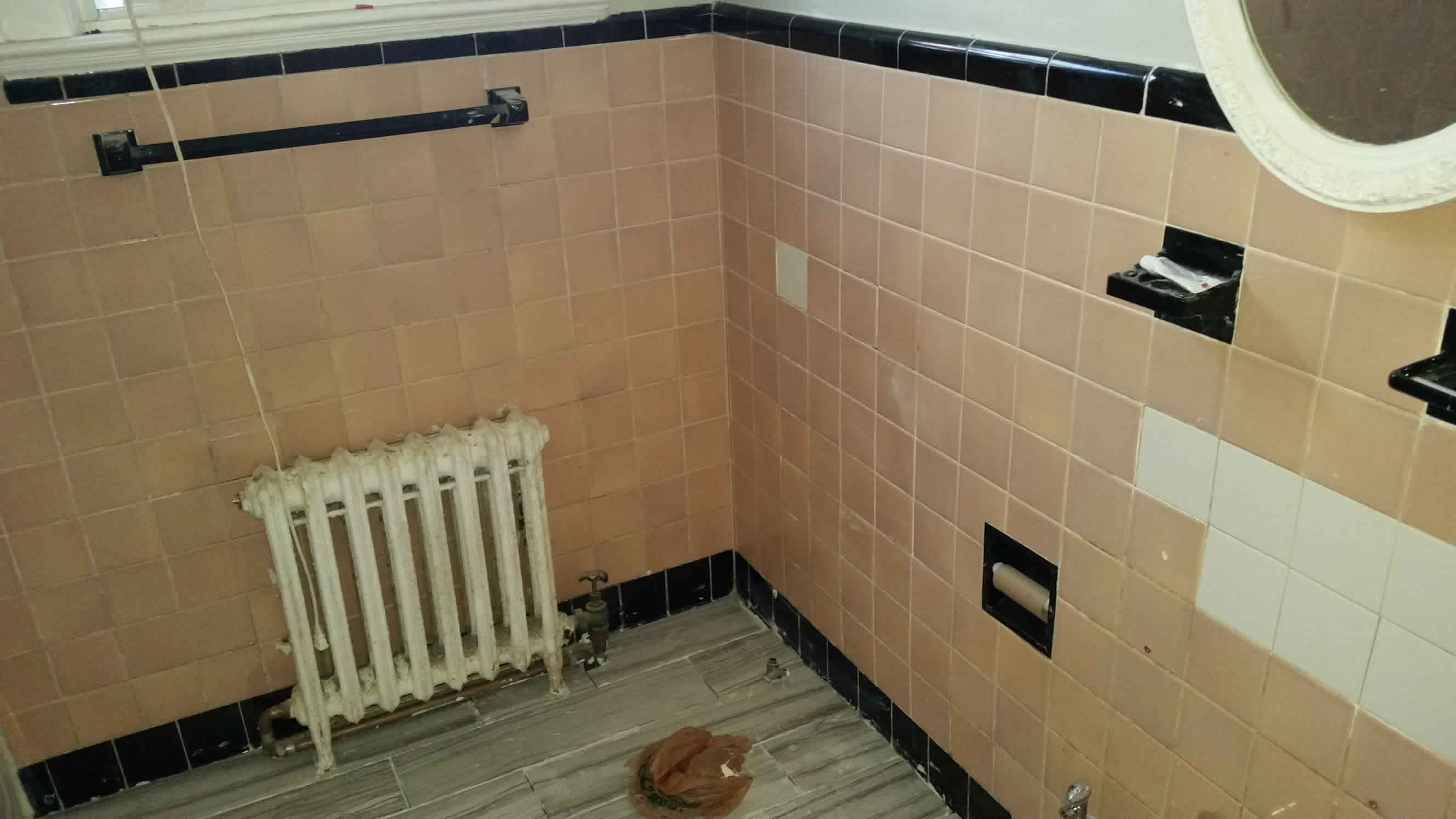 Old bathroom walls with mismatched tiles?